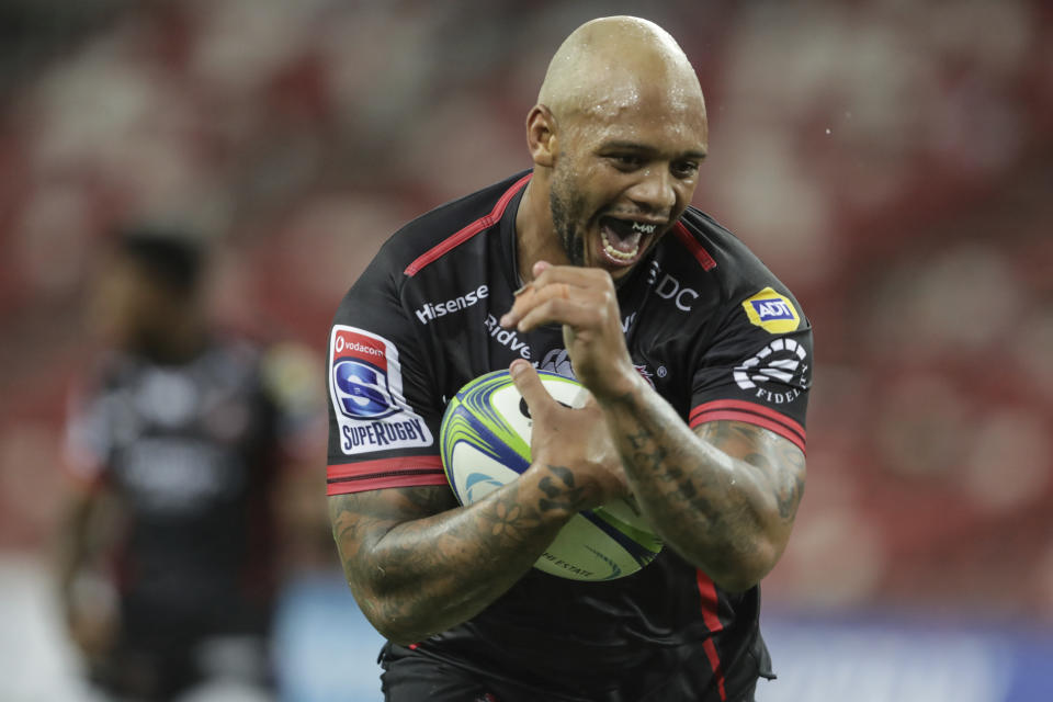 Lionel Mapoe of the Lions celebrates after a try during the Super Rugby match between the Sunwolves and the Lions at Singapore National Stadium, in Singapore, Saturday, March 23, 2019. (AP Photo/Danial Hakim)