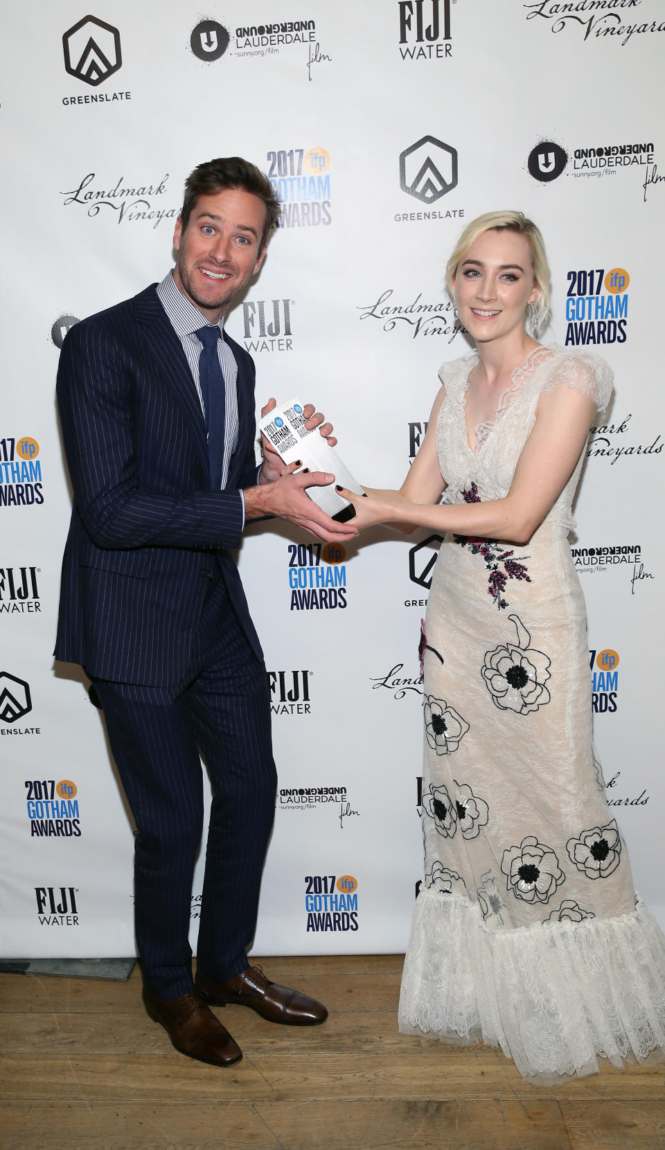 NEW YORK, NY - NOVEMBER 27:  Armie Hammer and Saoirse Ronan poses with her award at the 2017 Gotham Awards sponsored by Greater Ft. Lauderdale Tourism at Cipriani, Wall Street on November 27, 2017 in New York City.  (Photo by Bennett Raglin/Getty Images for Greater Fort Lauderdale Convention & Visitors Bureau)