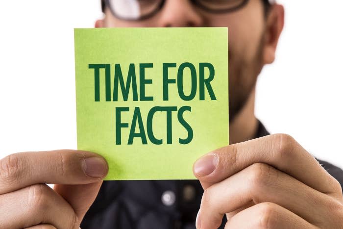 Man holding up a "Time for Facts" label