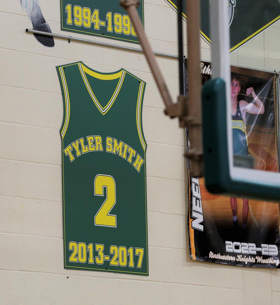 Tyler Smith's retired No. 2 jersey hangs in Northeastern's Larry Moore Gymnasium during Smith's jersey retirement ceremony Feb. 17, 2023.