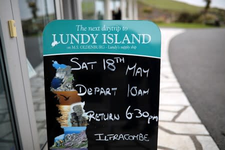 A sign advertising a boat trip to Lundy Island is seen in Ilfracombe