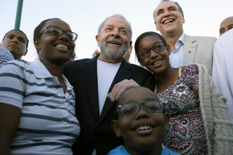 Former Brazilian president Luiz Inacio Lula da Silva poses with supporters during his bus tour of northeastern Brazil