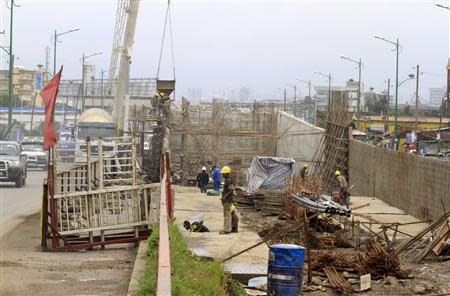 Labourers work at a railway station construction site in Ethiopia's capital Addis Ababa, September 16, 2013. REUTERS/Tiksa Negeri