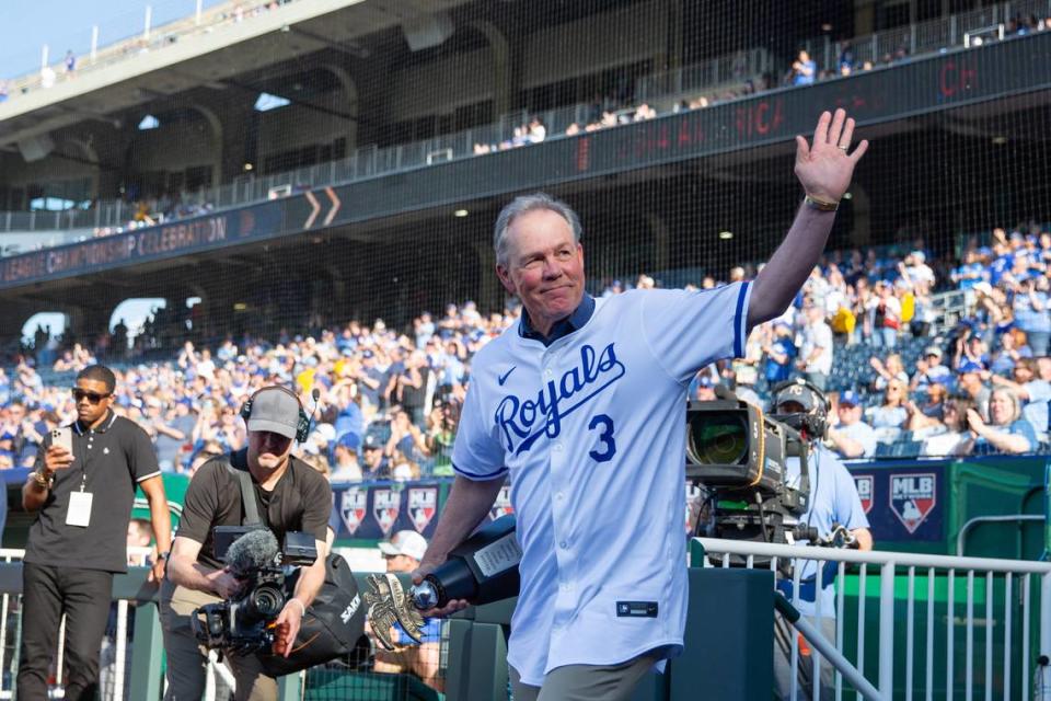 Former Kansas City Royals manager Ned Yost waves to the crowd as he walks onto the field for a pre-game ceremony honoring the club’s 2014 American League champions at Kauffman Stadium on Friday, May 17, 2024.