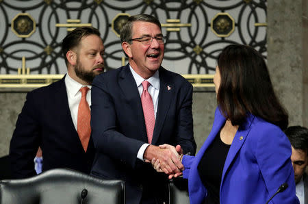 U.S. Defense Secretary Ash Carter shakes hands with Sen. Kelly Ayotte (R-NH) before a Senate Armed Services Committee hearing on National Security Challenges and Ongoing Military Operations on Capitol Hill in Washington, U.S., September 22, 2016. REUTERS/Yuri Gripas