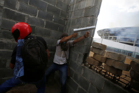 A demonstrator fires a homemade mortar towards riot police during a protest over a controversial reform to the pension plans of the Nicaraguan Social Security Institute (INSS) in Managua, Nicaragua April 20, 2018. REUTERS/Jorge Cabrera