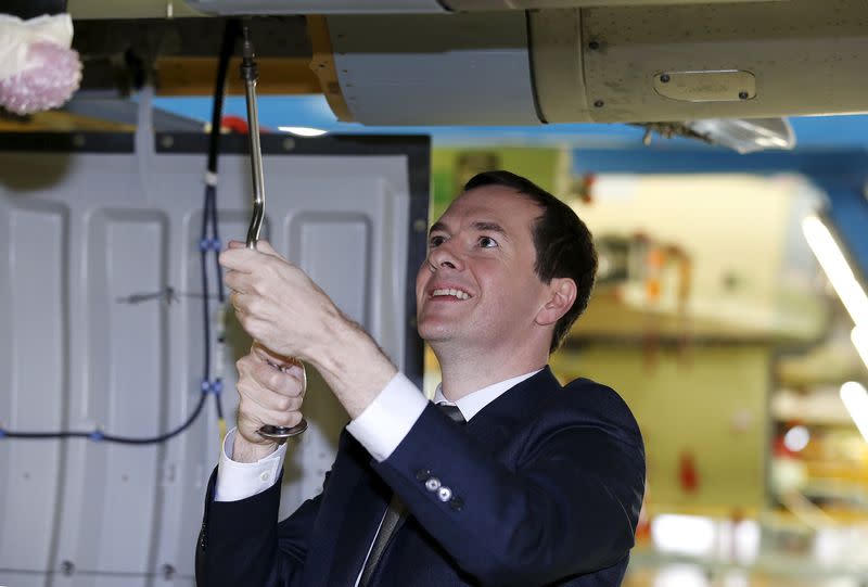 Britain's Chancellor of the Exchequer George Osborne works on a Eurofighter Typhoon fighter jet during his visit to BAE Systems in Wharton, northern England, July 9, 2015. REUTERS/Andrew Yates