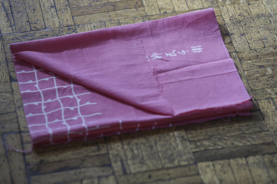 A folded handkerchief, used in the Japanese traditional Hanayagi-style dance, lays on the floor of Professor Naoko Kihara's dance studio in Mexico City, Friday, Nov. 24, 2023. (AP Photo/Ginnette Riquelme)