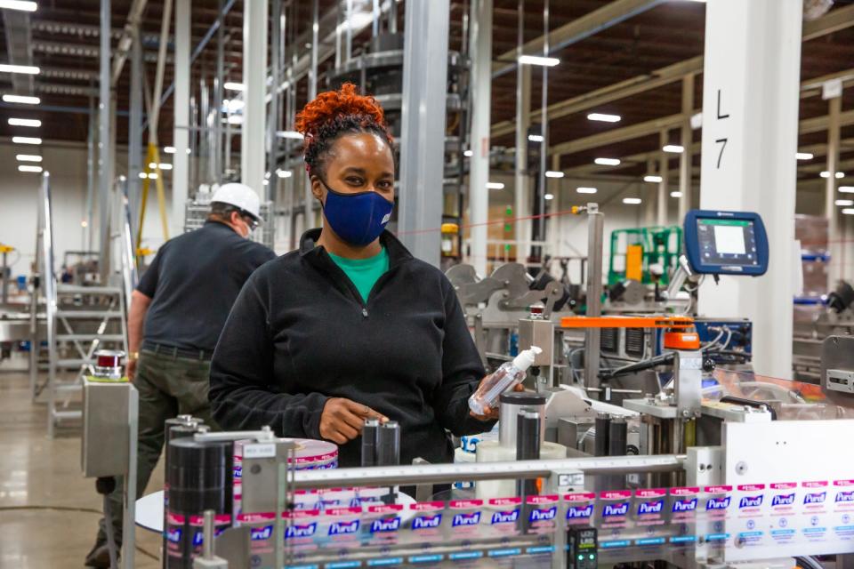 GOJO employee Nicole Goolsby works on the assembly line at the company's plant in Wooster.