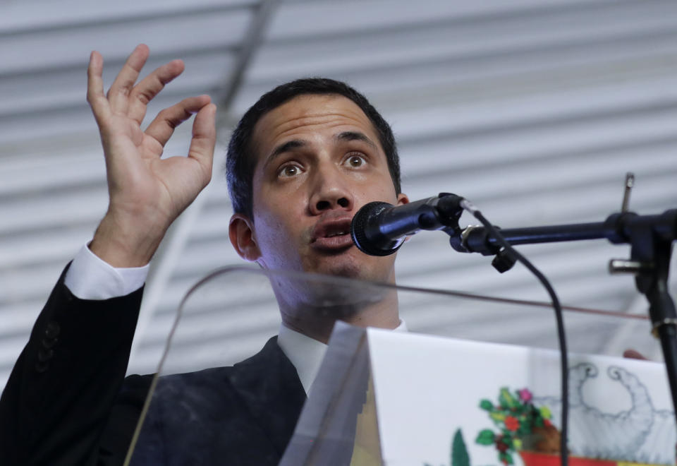 Venezuela's self-proclaimed interim president Juan Guaido talks during a meeting with electricity experts in Caracas, Venezuela, Thursday, March 28, 2019. The Venezuelan government on Thursday said it has barred Guaido from holding public office for 15 years, though the National Assembly leader responded soon afterward that he would continue his campaign to oust President Nicolas Maduro. (AP Photo/Natacha Pisarenko)