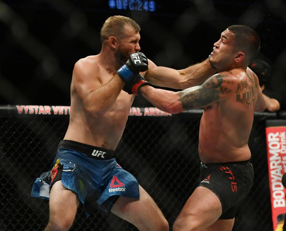 Donald "Cowboy" Cerrone, left, landing a punch in a loss to Anthony Pettis in Jacksonville, Fla., in May, returns to Austin to fight Joe Lauzon on Saturday at Moody Center. The 39-year-old says he will fight twice more, then retire.