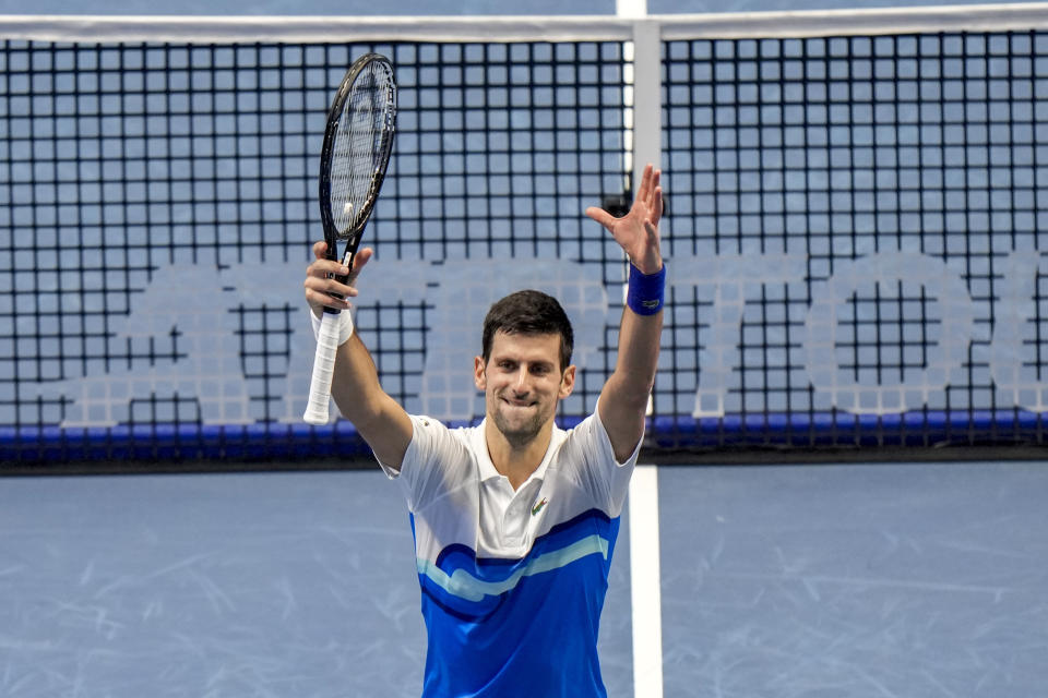 Serbia's Novak Djokovic celebrates after defeating Britain's Cameron Norrie during their ATP World Tour Finals singles tennis match, at the Pala Alpitour in Turin, Friday, Nov. 19, 2021. Djokovic won 6-2, 6-1.(AP Photo/Luca Bruno)