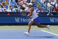 Ashleigh Barty, of Australia, runs after a shot by Jil Teichmann, of Switzerland, in the women's single final of the Western & Southern Open tennis tournament, Sunday, Aug. 22, 2021, in Mason, Ohio. (AP Photo/Darron Cummings)