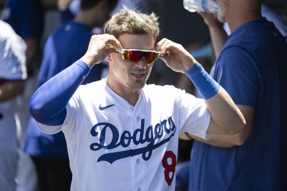 Los Angeles Dodgers' Kiké Hernández wears his sunglasses in the dugout before a baseball game against the Toronto Blue Jays in Los Angeles, Wednesday, July 26, 2023. (AP Photo/Kyusung Gong)