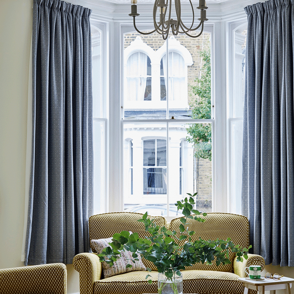 Blue curtains in white living room