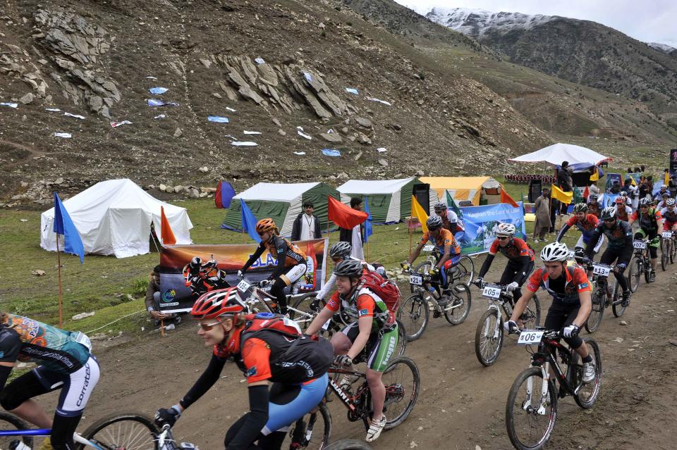 International and local Pakistani cyclists compete during the first stage of the Himalayas 2011 International Mountainbike Race in the mountainous area of Jalkhand in Pakistan's tourist region of Naran in Khyber Pakhtunkhwa province on September 16, 2011. The cycling event, organised by the Kaghan Memorial Trust to raise funds for its charity school set up in the Kaghan valley for children affected in the October 2005 earthquake, attracted some 30 International and 11 Pakistani cyclists. AFP PHOTO / AAMIR QURESHI (Photo credit should read AAMIR QURESHI/AFP/Getty Images)