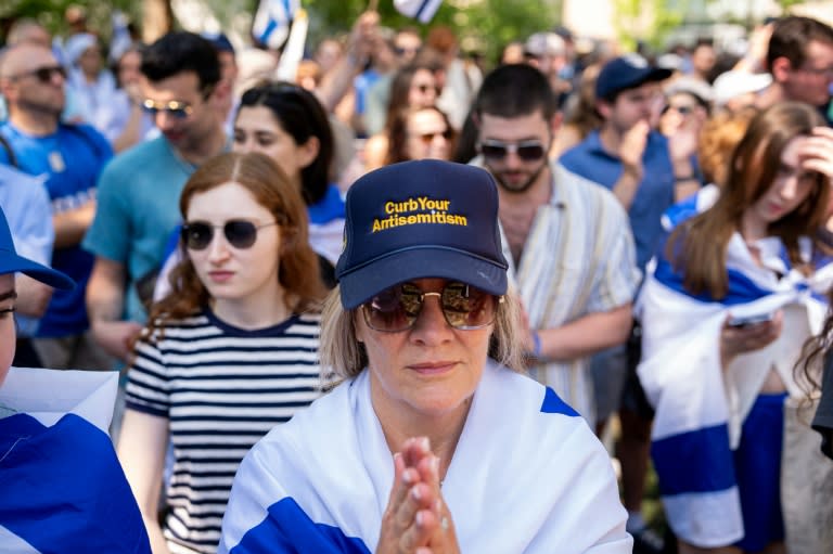A woman wears a hat that reads "Curb Your Antisemitism" during a rally against campus antisemitism at George Washington University on May 2 (Andrew Harnik)