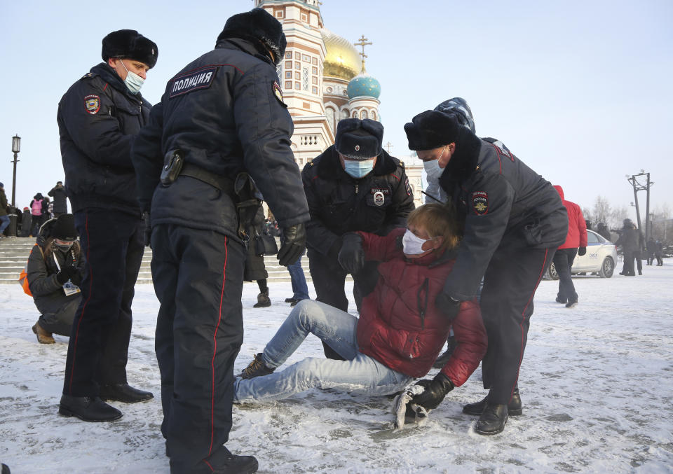 Police detain a man during a protest against the jailing of opposition leader Alexei Navalny in Siberian city of Omsk, Russia, Saturday, Jan. 23, 2021. Russian police on Saturday arrested hundreds of protesters who took to the streets in temperatures as low as minus-50 C (minus-58 F) to demand the release of Alexei Navalny, the country's top opposition figure. Navalny, President Vladimir Putin's most prominent foe, was arrested on Jan. 17 when he returned to Moscow from Germany, where he had spent five months recovering from a severe nerve-agent poisoning that he blames on the Kremlin (AP Photo)