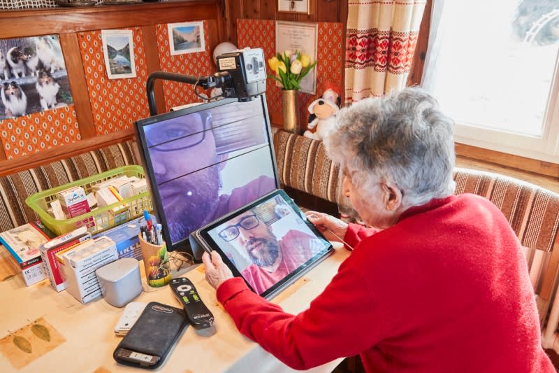 Fatton talks with her grandchild Ismael in Le Locle