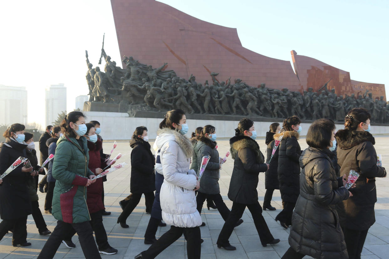 Pyongyang citizens visit Mansu Hill to pay respect to the statues of their late leaders Kim Il Sung and Kim Jong Il on the occasion of the 75th founding anniversary of the Korean People's Army in Pyongyang, North Korea Wednesday, Feb. 8, 2023. (AP Photo/Cha Song Ho)