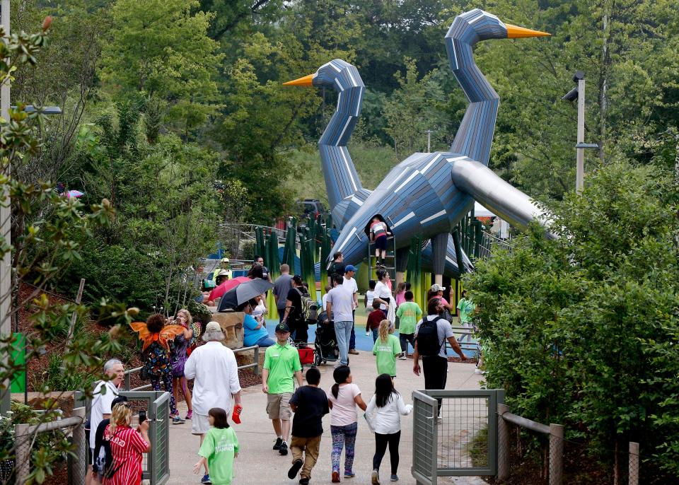 Visitors enjoy the Adventure Playground during the opening of Gathering Place in Tulsa in September 2018.