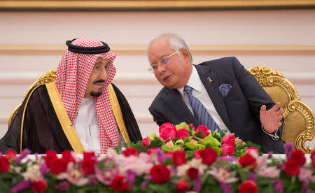 Saudi Arabia's King Salman and Malaysia's Prime Minister Najib Razak attend a Memorandum of Understanding signing ceremony in Putrajaya, Malaysia, February 27, 2017. Bandar Algaloud/Courtesy of Saudi Royal Court/Handout via REUTERS/Files