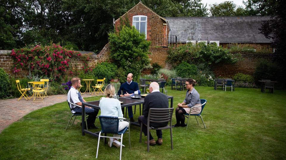 Prince William sitting in the garden of the The Rose & Crown pub 