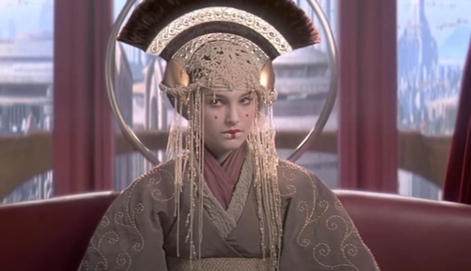 The Queen in Phantom Menace, dressed in an excuberant headpiece