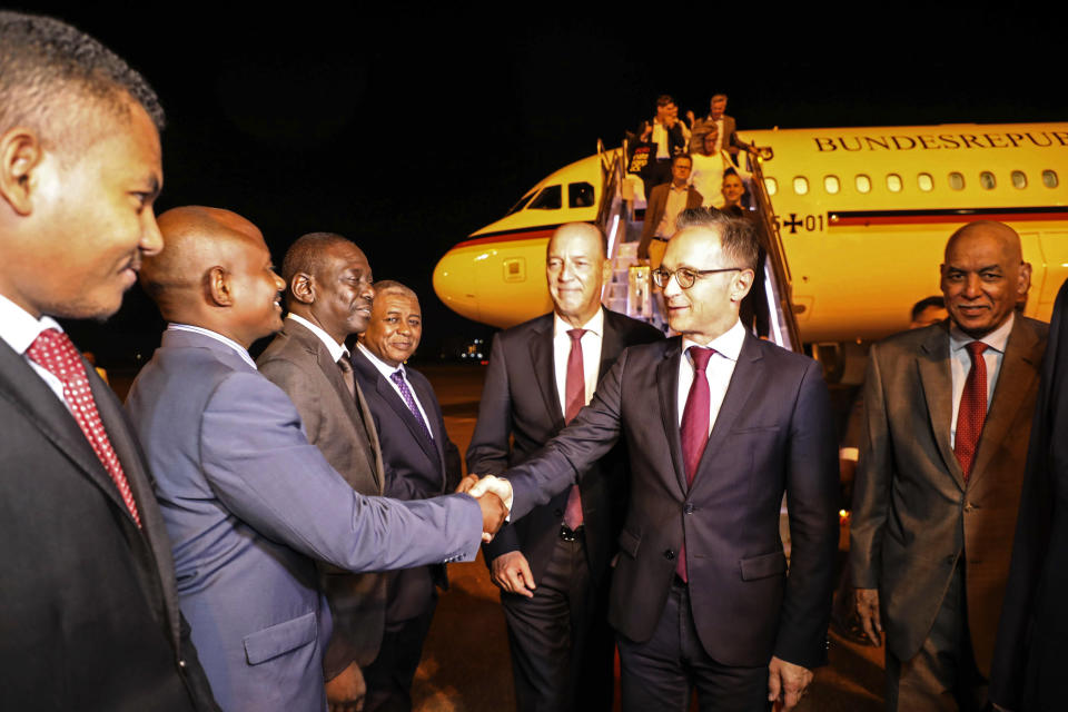 Foreign Minister of Germany Heiko Maas, center, is greeted by Sudanese officials as he walks with Sudanese Undersecretary of the Foreign Ministry Omer Dahab Fadl Mohamed, right, at the Khartoum International Airport in Sudan, early Tuesday, Sept. 3, 2019. Sudan’s state-run news agency said Maas arrived in Sudan in a first visit by a German top diplomat to the African country since 2011. ups, which remain among the top challenges facing the country’s new administration. (AP Photo)
