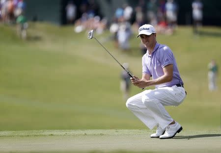 Sep 24, 2017; Atlanta, GA, USA; Justin Thomas reacts to his putt on the eighth green during the final round of the Tour Championship golf tournament at East Lake Golf Club. Mandatory Credit: Brett Davis-USA TODAY Sports