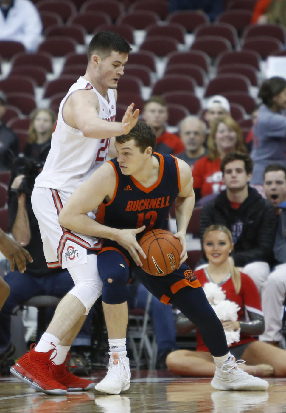 Bucknell's John Meeks, right, posts up against Ohio State's Kyle Young during the second half of an NCAA college basketball game Saturday, Dec. 15, 2018, in Columbus, Ohio. Ohio State beat Bucknell 73-71. (AP Photo/Jay LaPrete)