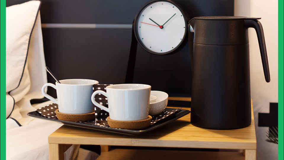 a clock and cups on a table