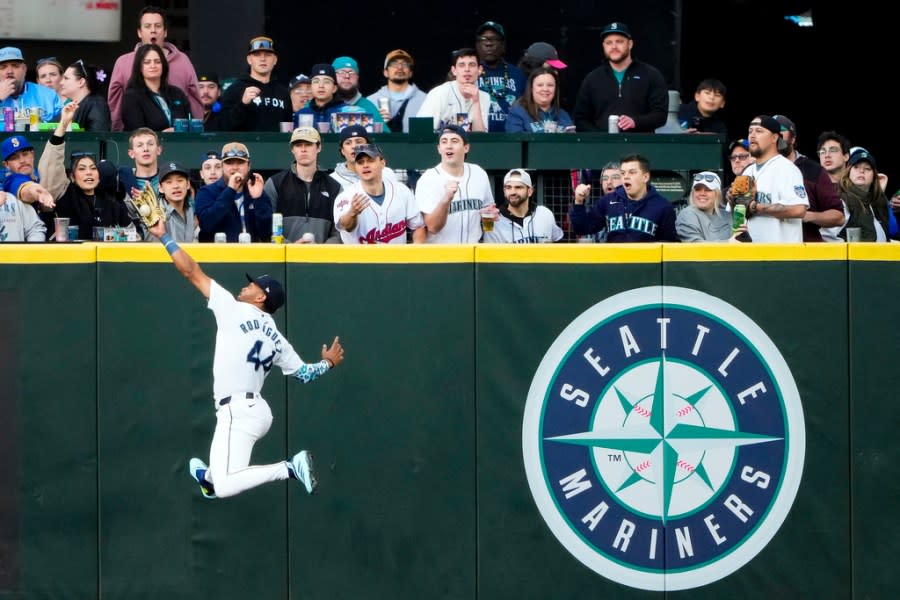 Seattle Mariners center fielder Julio Rodríguez makes a leaping catch on a fly ball hit by Cleveland Guardians’ Will Brennan during the second inning of a baseball game Monday, April 1, 2024, in Seattle. (AP Photo/Lindsey Wasson)