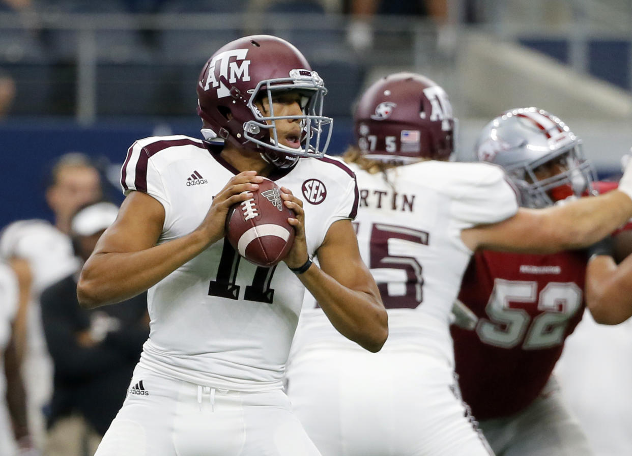 Texas A&M quarterback Kellen Mond (11) drops back to pass in the first half of an NCAA college football game against Arkansas on Saturday, Sept. 23, 2017, in Arlington, Texas. (AP Photo/Tony Gutierrez)