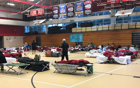 People seen in the hurricane shelter set up in the Belle Chasse High School gym in advance of Hurricane Nate in Belle Chasse, Louisiana, U.S. October 7, 2017. REUTERS/Jessica Resnick-Ault