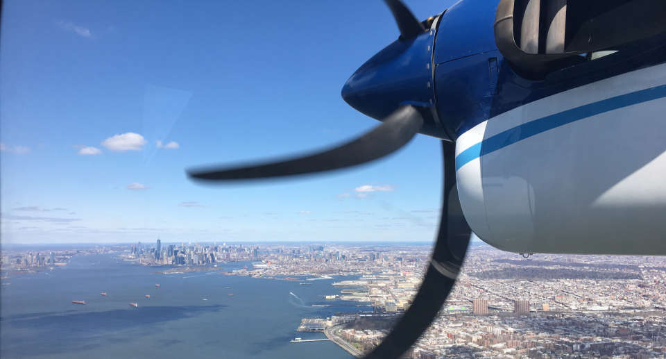 In this 2018 photo, a Twin Otter aircraft flies over New York Harbor and New York City on a research mission. In older Eastern US cities, nine times as much natural gas is leaking out of pipelines, homes than federal government had thought. NOAA's airplane sees much more methane coming out of New York City, Washington, Boston, Philadelphia, Baltimore and Providence than EPA had figured. Scientists said Monday, July 22, 2019, it isn’t a safety problem, but it is a climate change issue. Fixing those leaks can help in the fight against global warming. (Eric Kort/University of Michigan via AP)