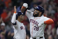 Houston Astros' Jon Singleton (28) celebrates with Jeremy Peña, left, after hitting a go-ahead two-run home run during the seventh inning of a baseball game against the Seattle Mariners, Sunday, May 5, 2024, in Houston. (AP Photo/Kevin M. Cox)