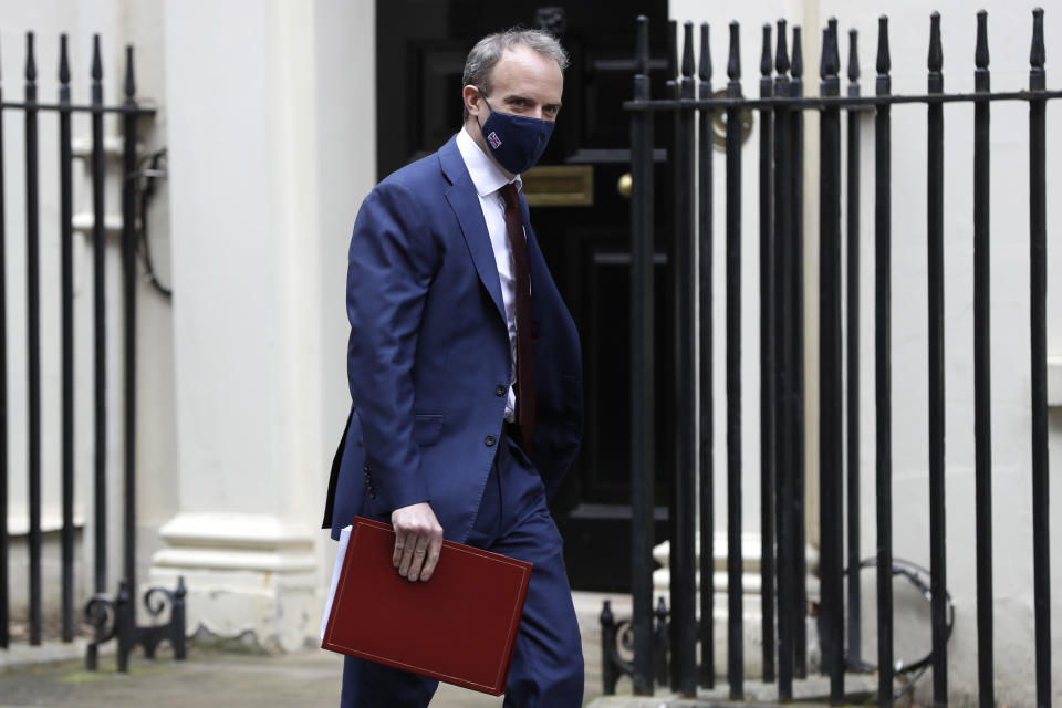 Britain's Foreign Secretary Dominic Raab walks across Downing Street in London, Wednesday, Feb. 24, 2021. (AP Photo/Kirsty Wigglesworth)