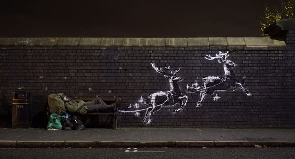 The latest mural from the secretive street artist features two reindeer painted onto a brick wall. (PA)