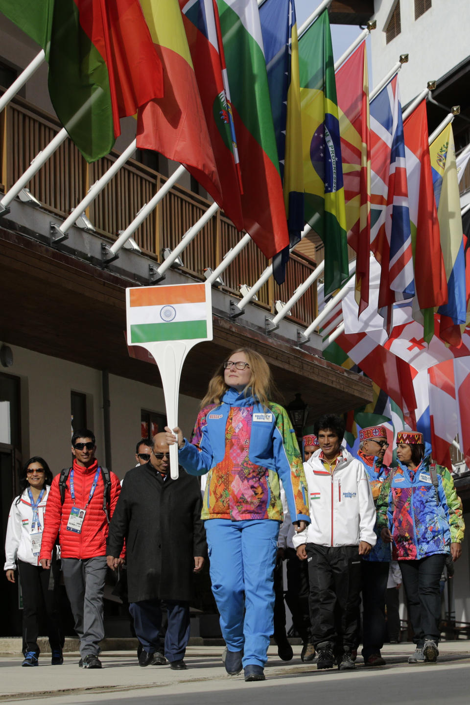 Members of the Indian Olympic team arrive for a welcome ceremony at the Mountain Olympic Village during the 2014 Winter Olympics, Sunday, Feb. 16, 2014, in Krasnaya Polyana, Russia. (AP Photo/Jae C. Hong)