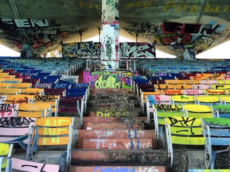 Graffiti covers the 6,500-seat Miami Marine Stadium which was built on an island just off downtown Miami, as seen in this picture taken November 13, 2014. REUTERS/Zachary Fagenson