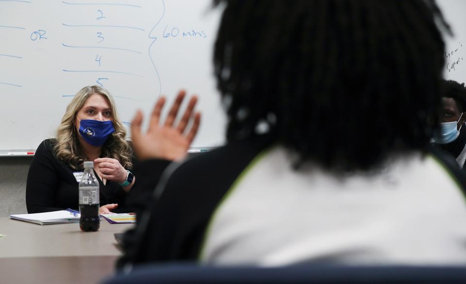 Valley High School student Jaime Dixon asks about the Everybody Counts program while speaking with school counselor Jessica Elble, left, at the school in Louisville, Ky. on Feb. 23, 2022.  