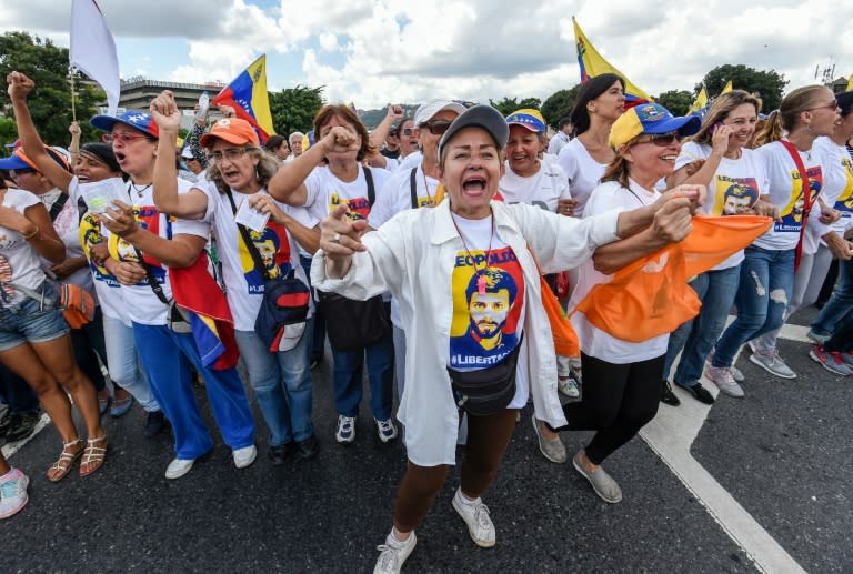 Women shout slogans against President Nicolas Maduro's government, during a demonstration in Caracas on October 22, 2016