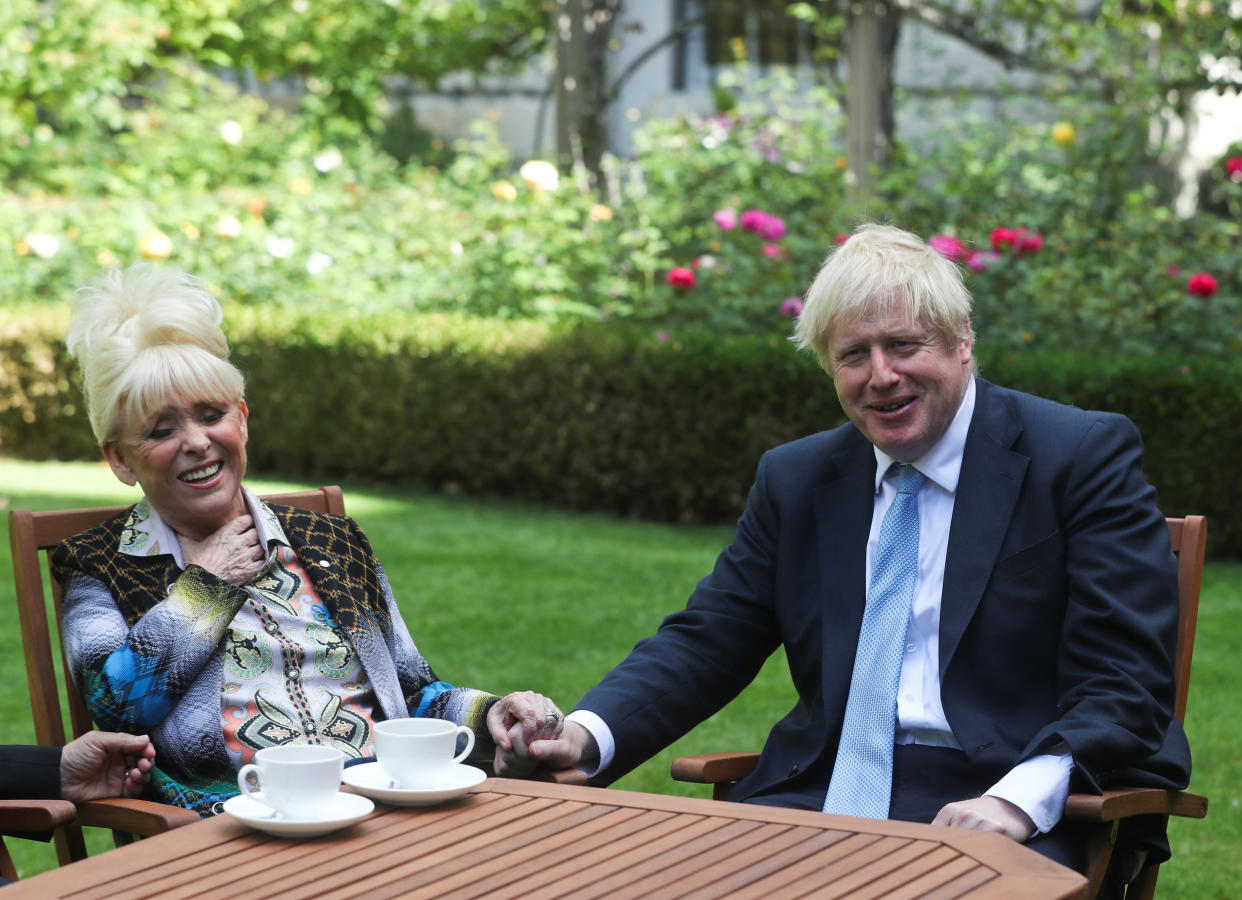 LONDON, ENGLAND - SEPTEMBER 02: Britain's Prime Minister Boris Johnson has a cup of tea with television actress Dame Barbara Windsor during a meeting in London on September 2, 2019 in London, England. Barbara Windsor, who suffers from Alzheimers, met with the Prime Minister at 10 Downing Street to discuss dementia care. (Photo by Simon Dawson - WPA Pool/Getty Images)