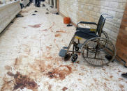 <p>A wheelchair is seen near blood stains of victims after an explosion at Al Rawdah mosque in Bir Al-Abed, Egypt, Nov. 25, 2017. (Photo: Mohamed Soliman/Reuters) </p>