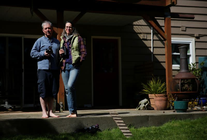 Burrell and husband Seifert, whose home-based business has been shuttered, at their home in Seattle