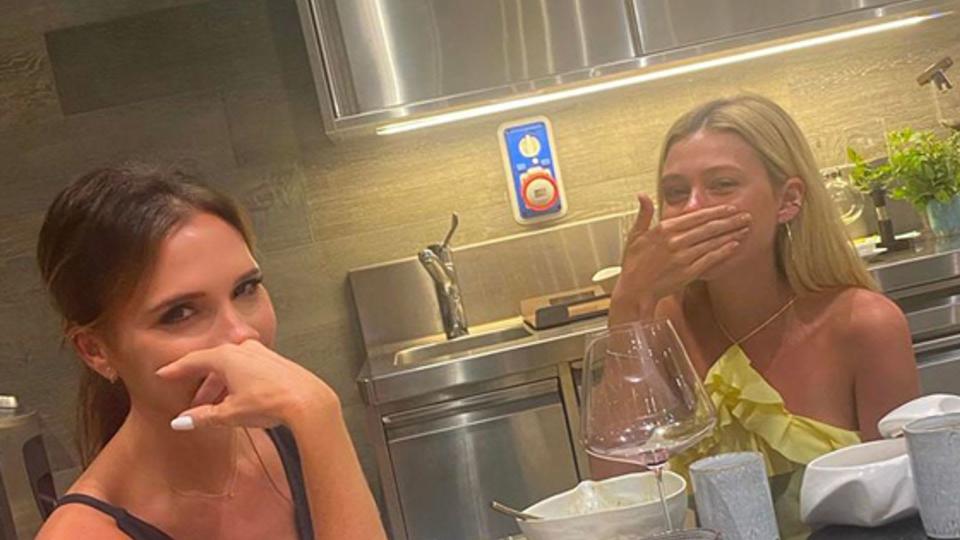 Victoria Beckham and Nicola Peltz in a kitchen