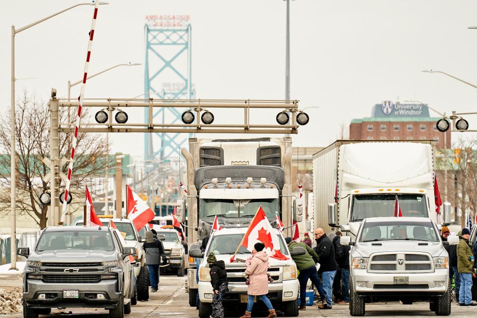 Supporters of the Truckers Convoy against the Covid-19 vaccine mandate block traffic in the Canada bound lanes of the Ambassador Bridge border crossing, in Windsor, Ontario on February 8, 2022. - The protestors have blocked traffic in the Canada bound lanes since Monday evening. Approximately $323 million worth of goods cross the Windsor-Detroit border each day at the Ambassador Bridge making it North Americas busiest international border crossing. (Photo by Geoff Robins / AFP) (Photo by GEOFF ROBINS/AFP via Getty Images)