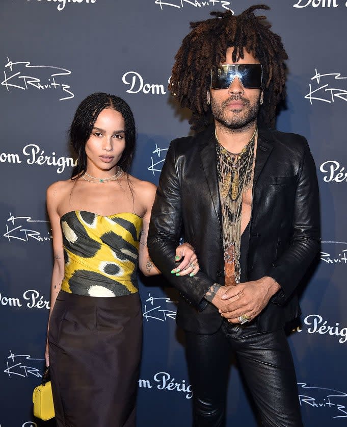 Father and daughter arm in arm on the red carpet