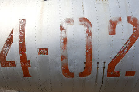 Names of soldiers are pictured at MiG-17 jet fighter's body in Kucova Air Base in Kucova, Albania, October 3, 2018. REUTERS/Florion Goga